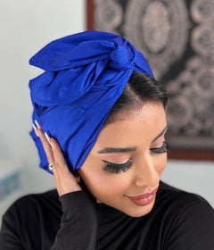  Woman in blue turban, looking confident and stylish.