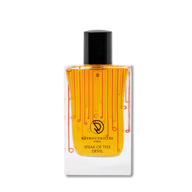A stylish orange and black bottle of perfume.