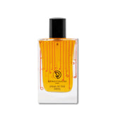 A stylish orange and black bottle of perfume.