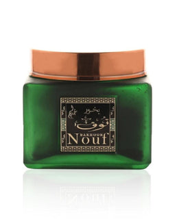 A jar of Nouf green tea body scrub, a natural exfoliant with antioxidant properties, perfect for rejuvenating the skin.