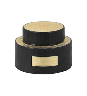 Black and gold box with elegant gold label, perfect for luxury gifts or special occasions.