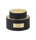 Black and gold box with elegant gold label, perfect for luxury gifts or special occasions.